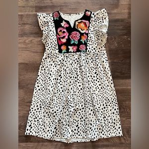 Boutique dress with floral detail neckline